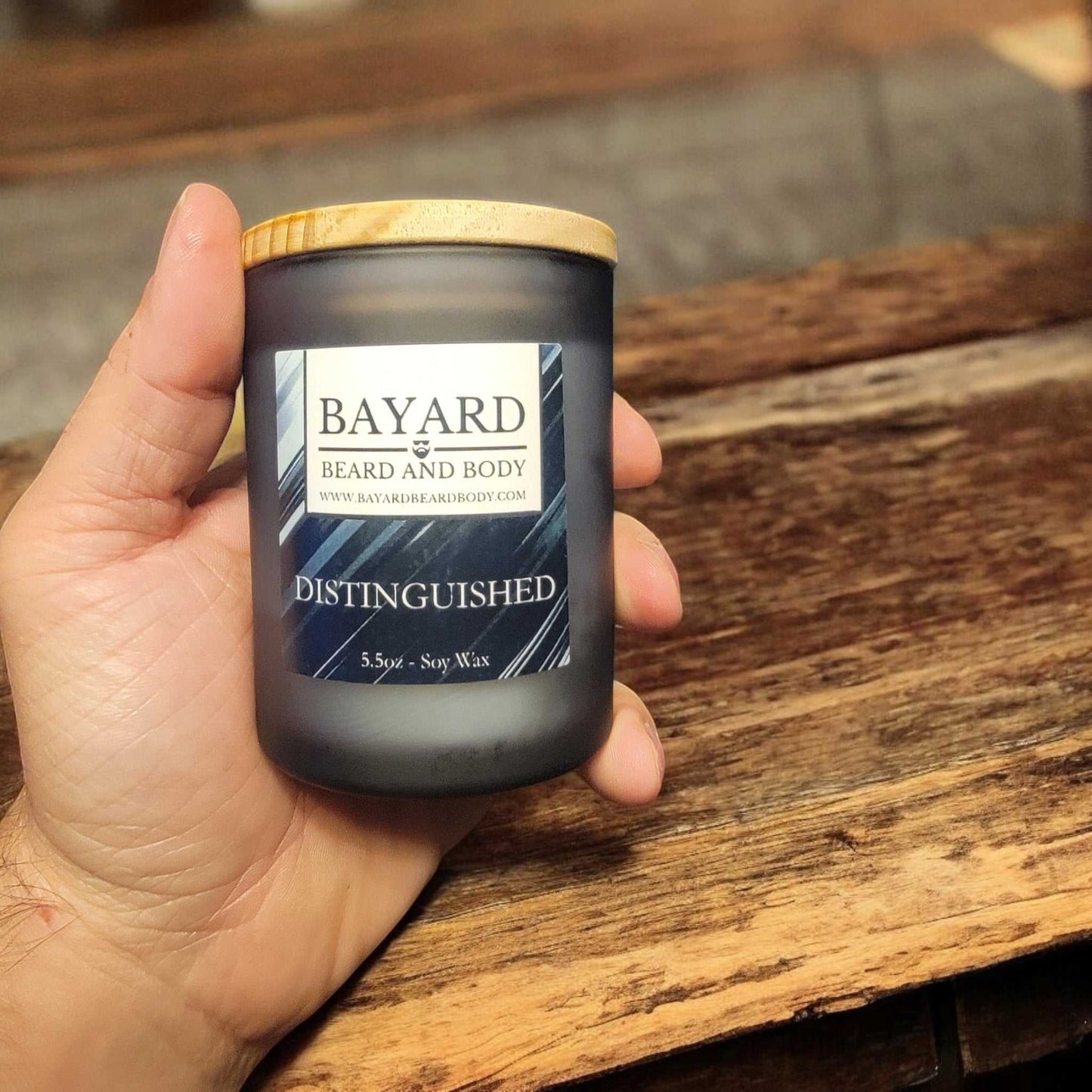 distinguished soy wax candle in a hand