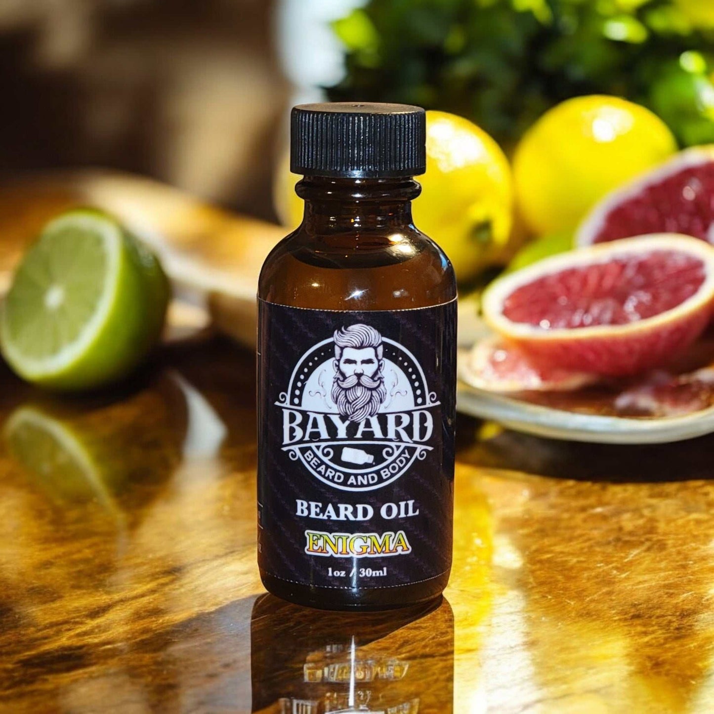 Enigma Beard Oil on a wood table with citrus.