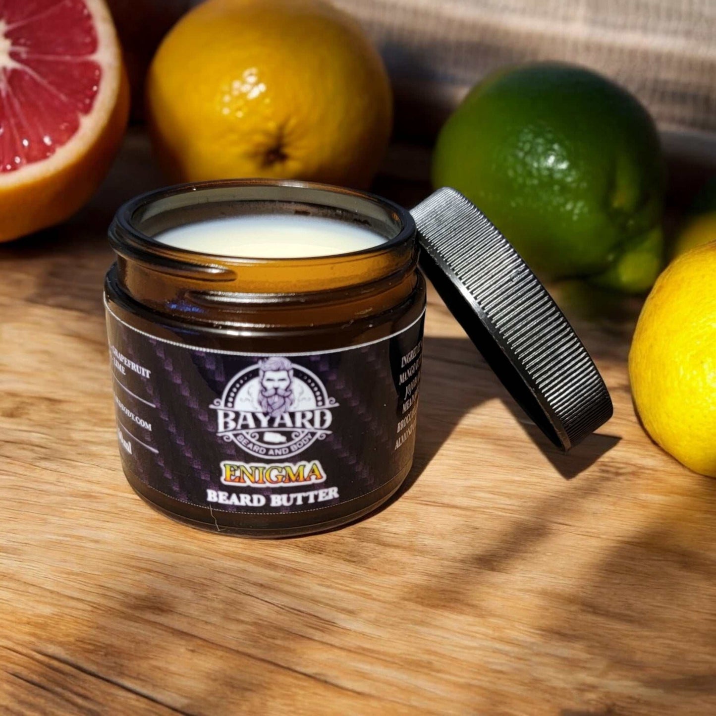 Enigma Beard Butter with citrus on a countertop 