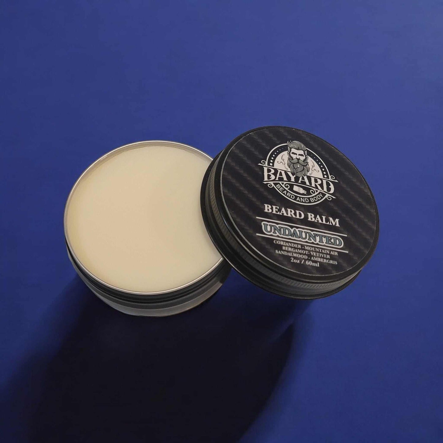 Undaunted Beard Balm on a dark blue countertop